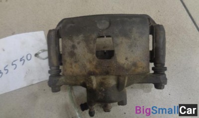 Суппорт передний левый от Nissan March K12 2002-2010