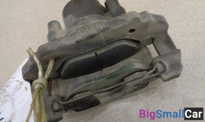 Суппорт передний правый от Mazda Demio DY 2003-2007