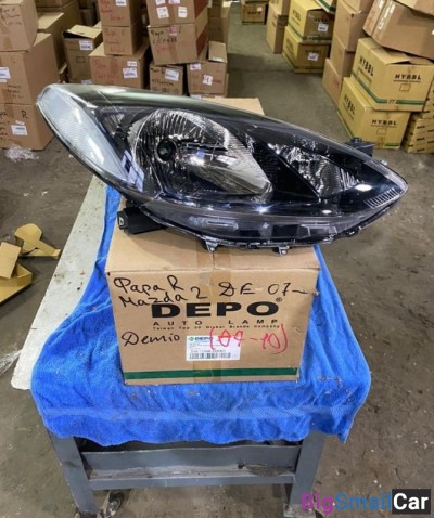 Фара левая Мазда Демио Mazda Demio